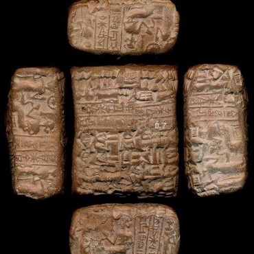 Picture of four sides of a clay tablet inscribed in cuneiform