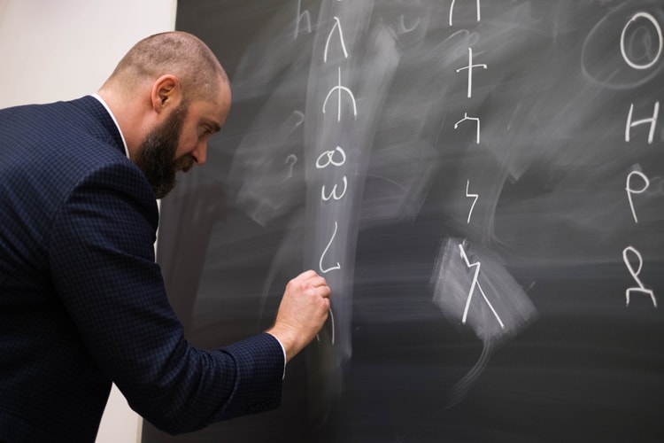 Professor Robert Holmstedt introduces students to orders of the alphabet in the first class on Ge'ez