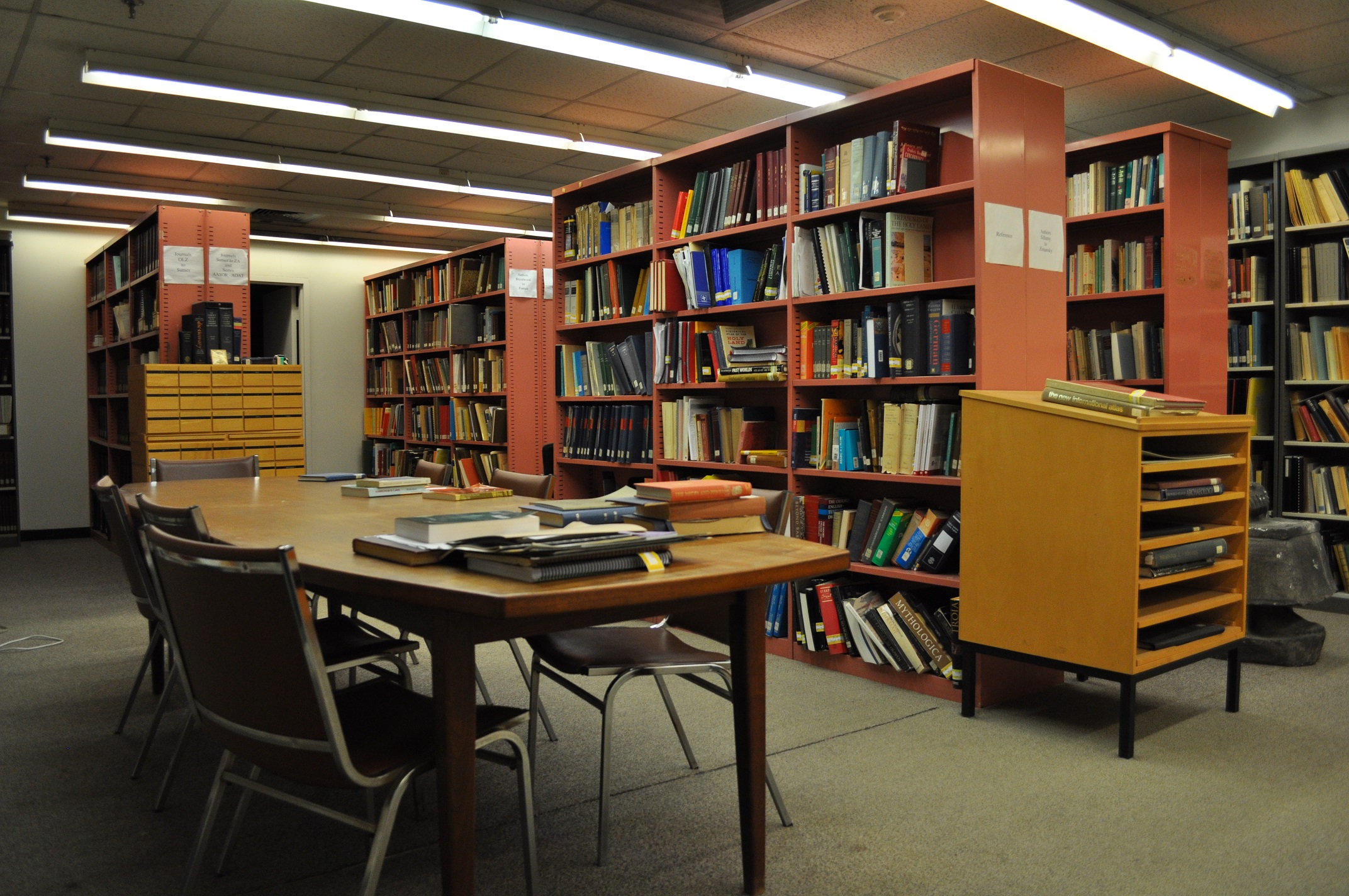library with desks, chairs and bookshelves 