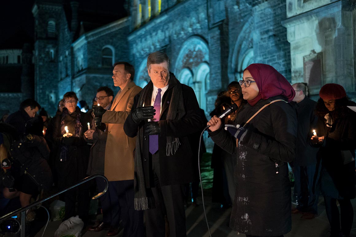 Attendees of the vigil, including Mayor John Tory