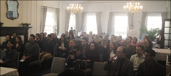 Attendees of the NMCGSA symposium sit in the audience