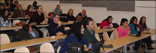 Attendees of the symposium sitting in the audience